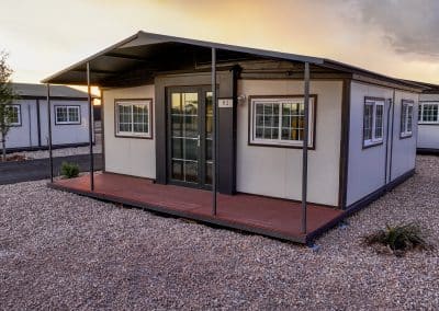 Iron Horse Living rental home in Odessa at sunset with covered porch and gravel landscaping.
